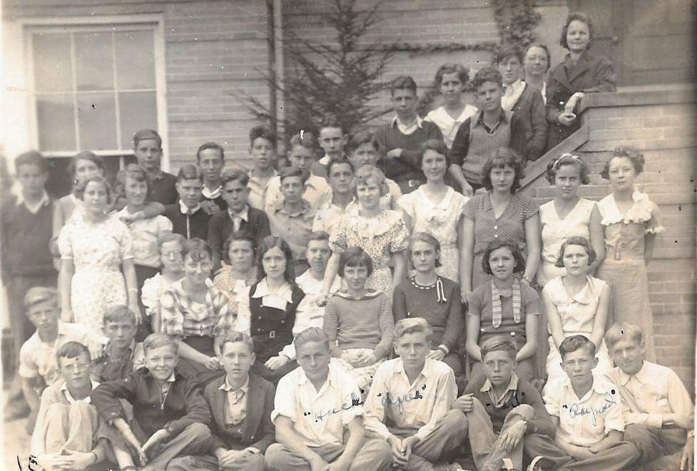 This photo is most likely Steece Elementary school. Taken in the late 1920's or early 1930's from Sandry Holderby's Mother's  collection.  She is standing at the top of the steps…Callie Blagg (Dillow). She listed the boys, but not all the girls, in no particular order: 