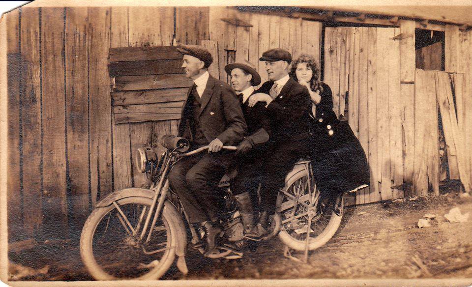 Carter Rucker, Wayne Wickline, Okey Lunsford and Faye Ferguson posing on a Harley-Davidson motorcycle by a barn in Lawrence Co., Ohio back in the day Photo Courtesy of Mark Howell