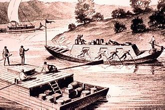 Barges twice: A long cigar-shaped keelboat passing a "flatboat" on the Ohio River. Photo Courtesy of Wikipedia